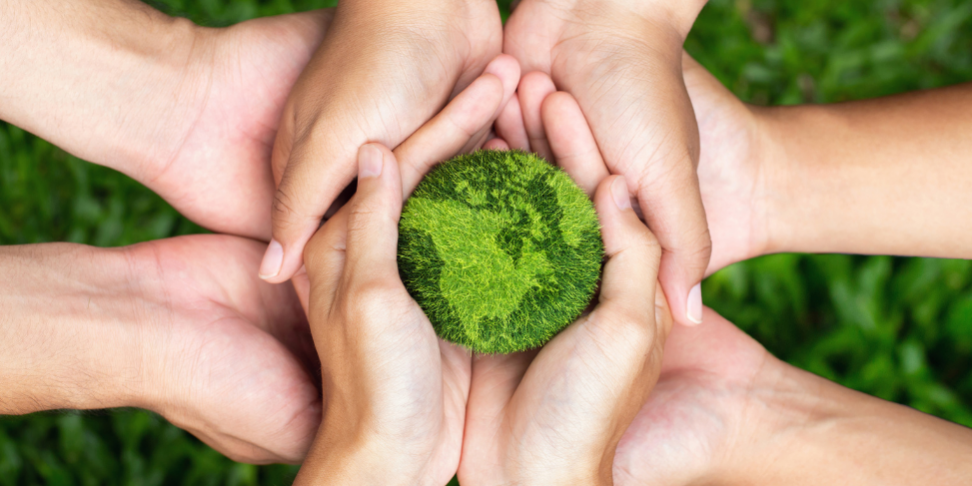 Blogpost-Image-Earth-Day Environment Earth day. Hands holding together a green earth