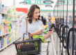 A woman checking on a frozen veggies packaging
