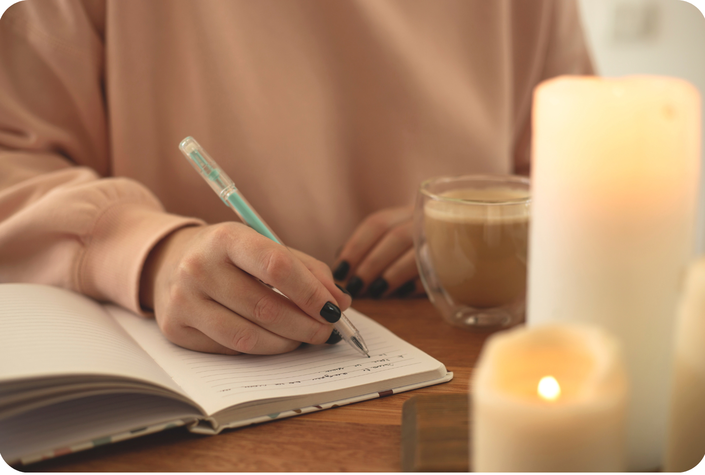 December blog image-3 A person writing on a journal.